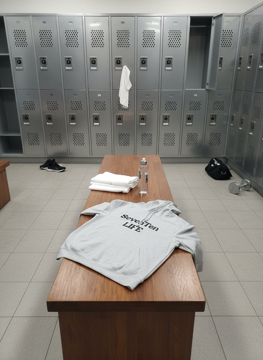 Beige hoodie with 'Seven Ten LIFE' text on a wooden floor