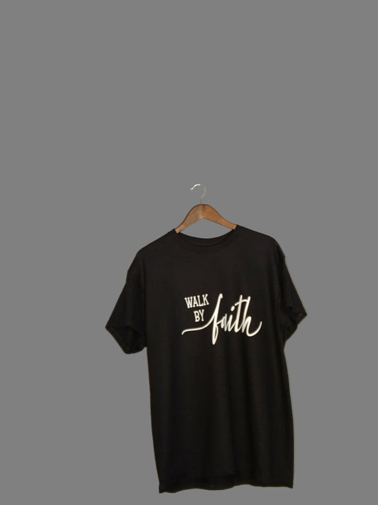 Black sleeveless shirt with white text on a hanger against a plain wall.