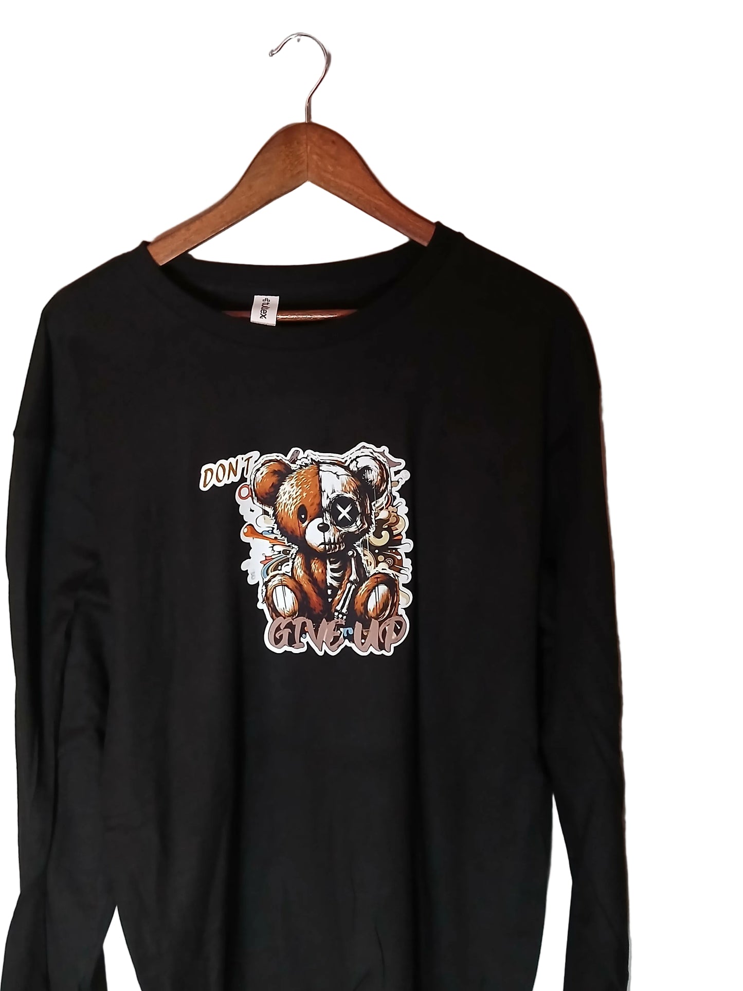 Long sleeve shirt by SevenTen LIFE with motivational "Don't Give Up" message and graphic design on soft fabric.